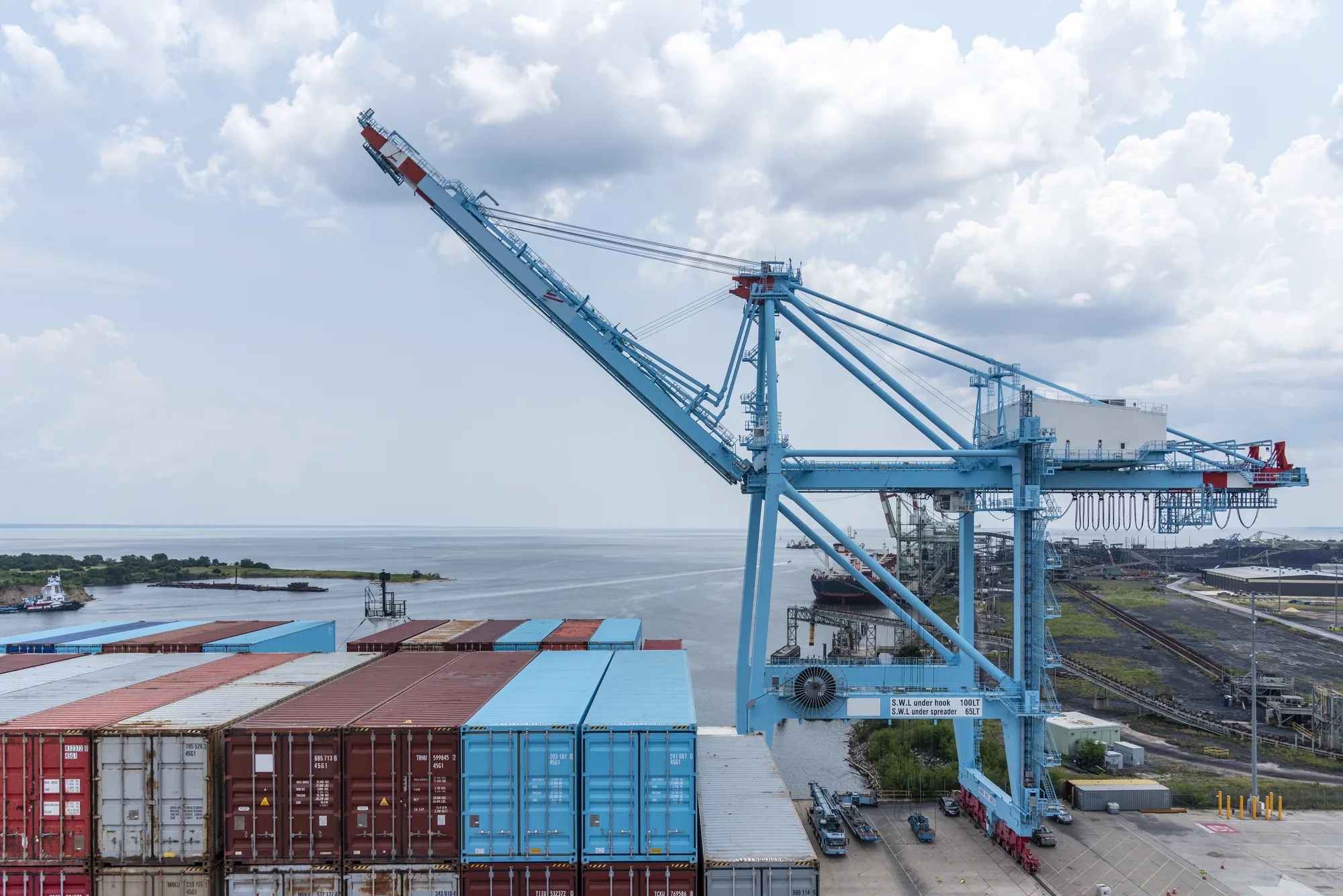 Shipping containers and cranes at a freight terminal